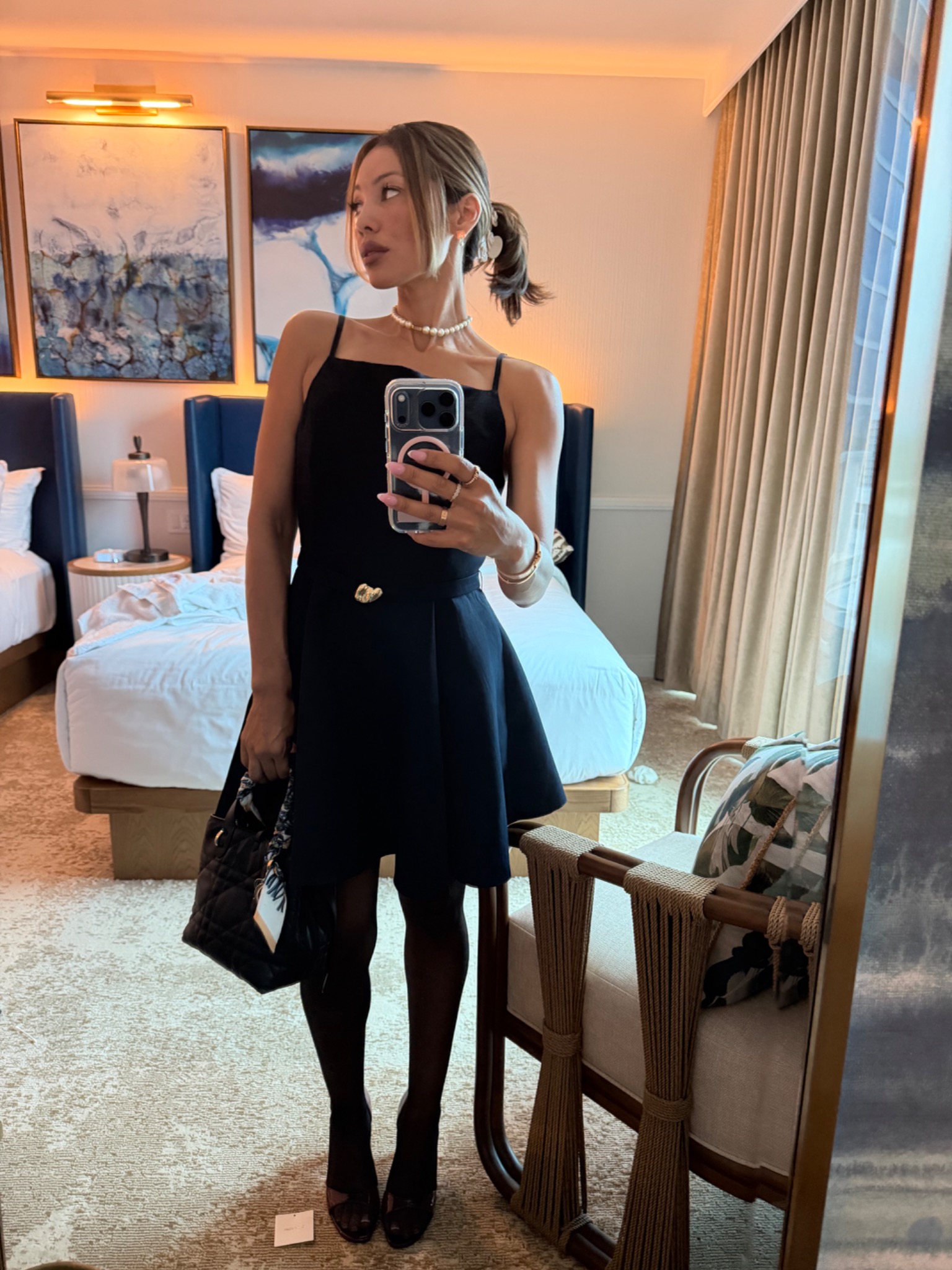 Founder of The Plug Method in a polished black dress